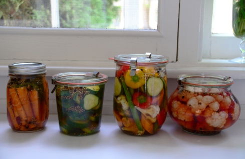 Four pickle jars